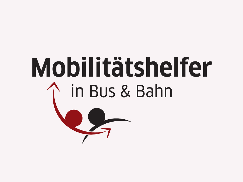 Zwei Mobilitätshelfer begleiten eine Person.